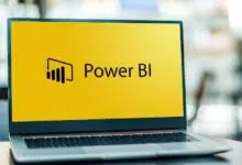 Laptop computer displaying logo of Power BI, a business analytics service by Microsoft