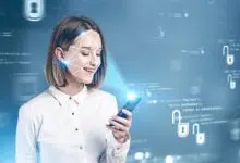 Smiling young woman in formal clothes using smartphone with face recognition technology over blurry blue background. Concept of biometric authentication and cyber security. Toned image double exposure