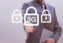 A businessman holding up a lock that reads 5G.