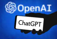 The ChatGPT logo on a phone in front of the OpenAI logo.
