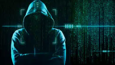 A cybercriminal in a background representing the dark web.