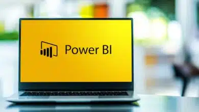 Power BI logo on a laptop.